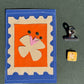 La fleur - Médaillon + Carte postale