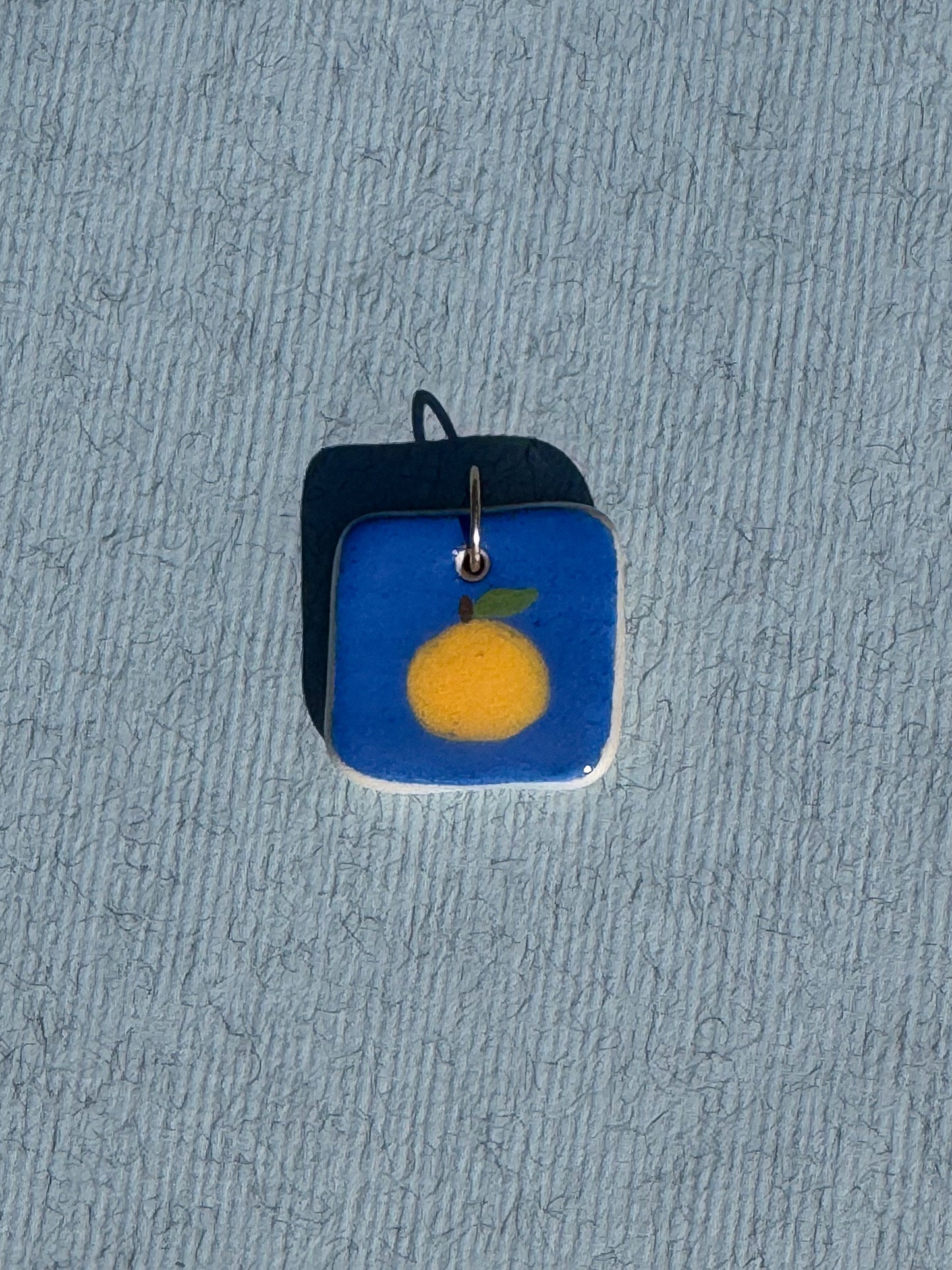 L'orange - Médaillon + Carte postale