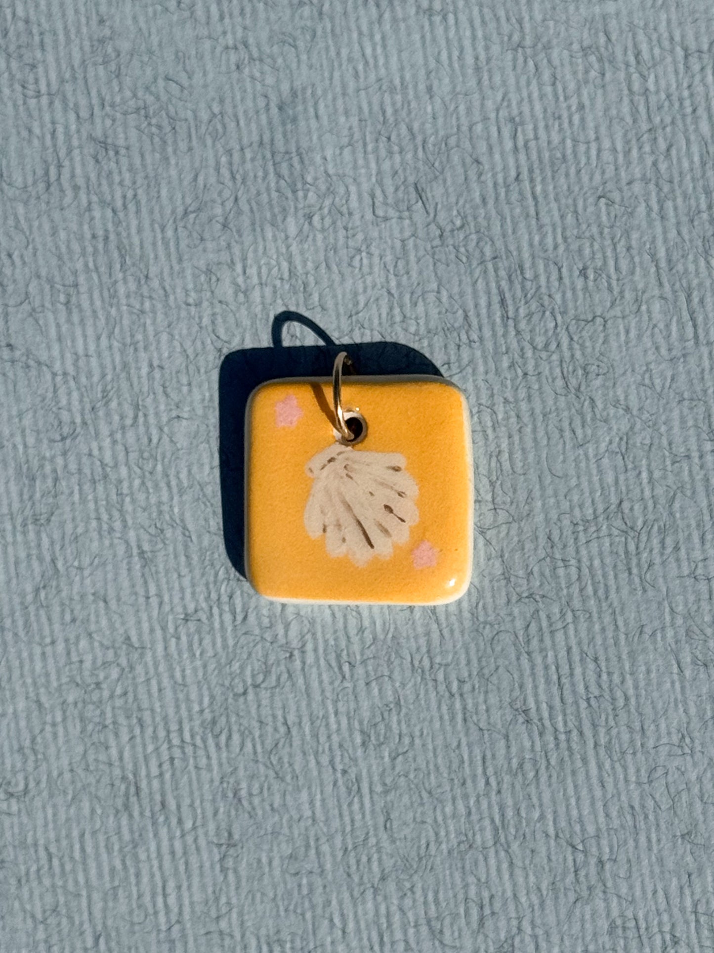 Le coquillage - Médaillon + Carte postale